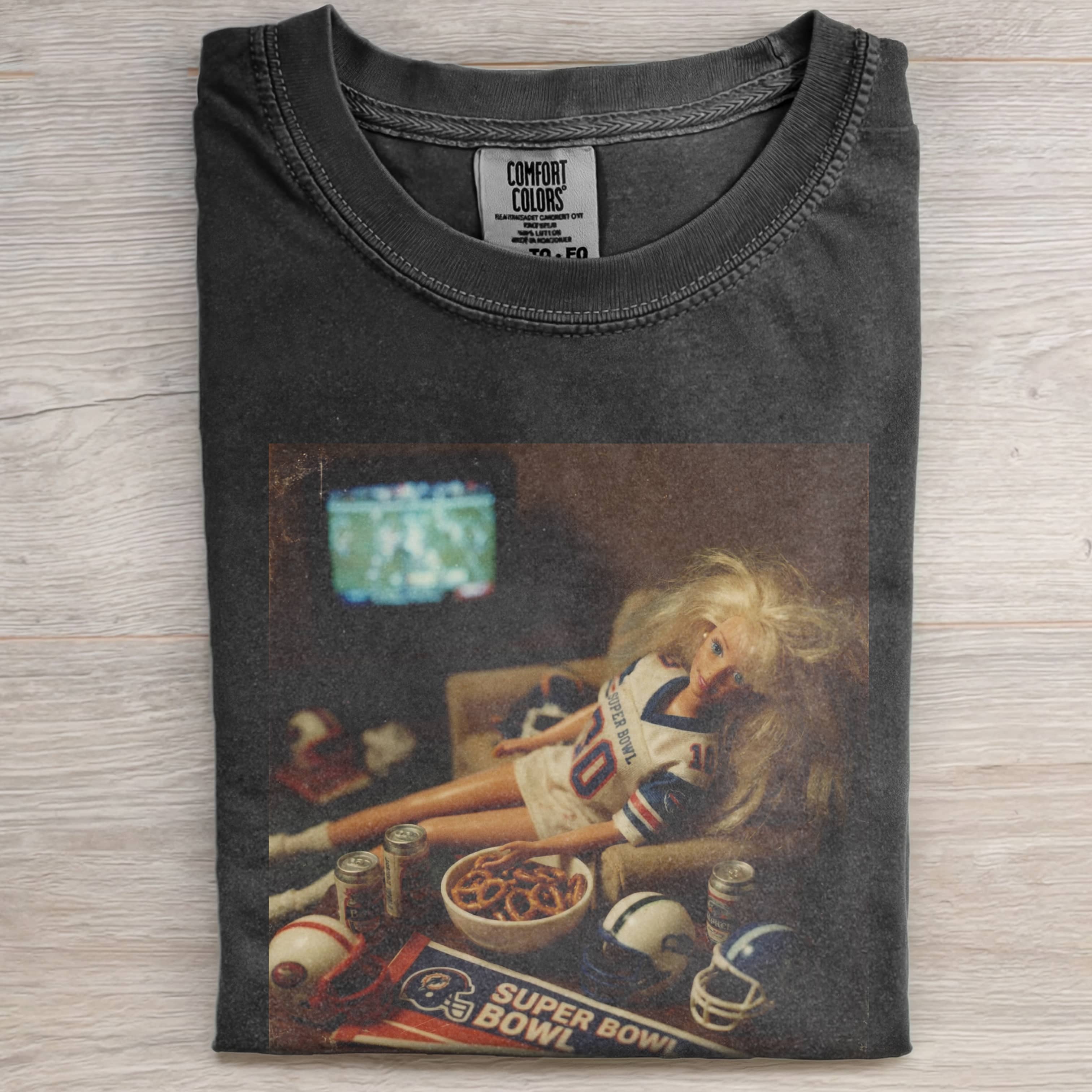 BARBIECORE IS SLACKING OFF AT HOME WITH A SUPER BOWL TEE